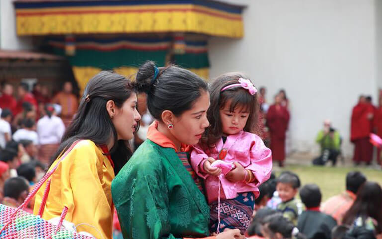 Locals are dressed up to celebrate Tshechu Festival